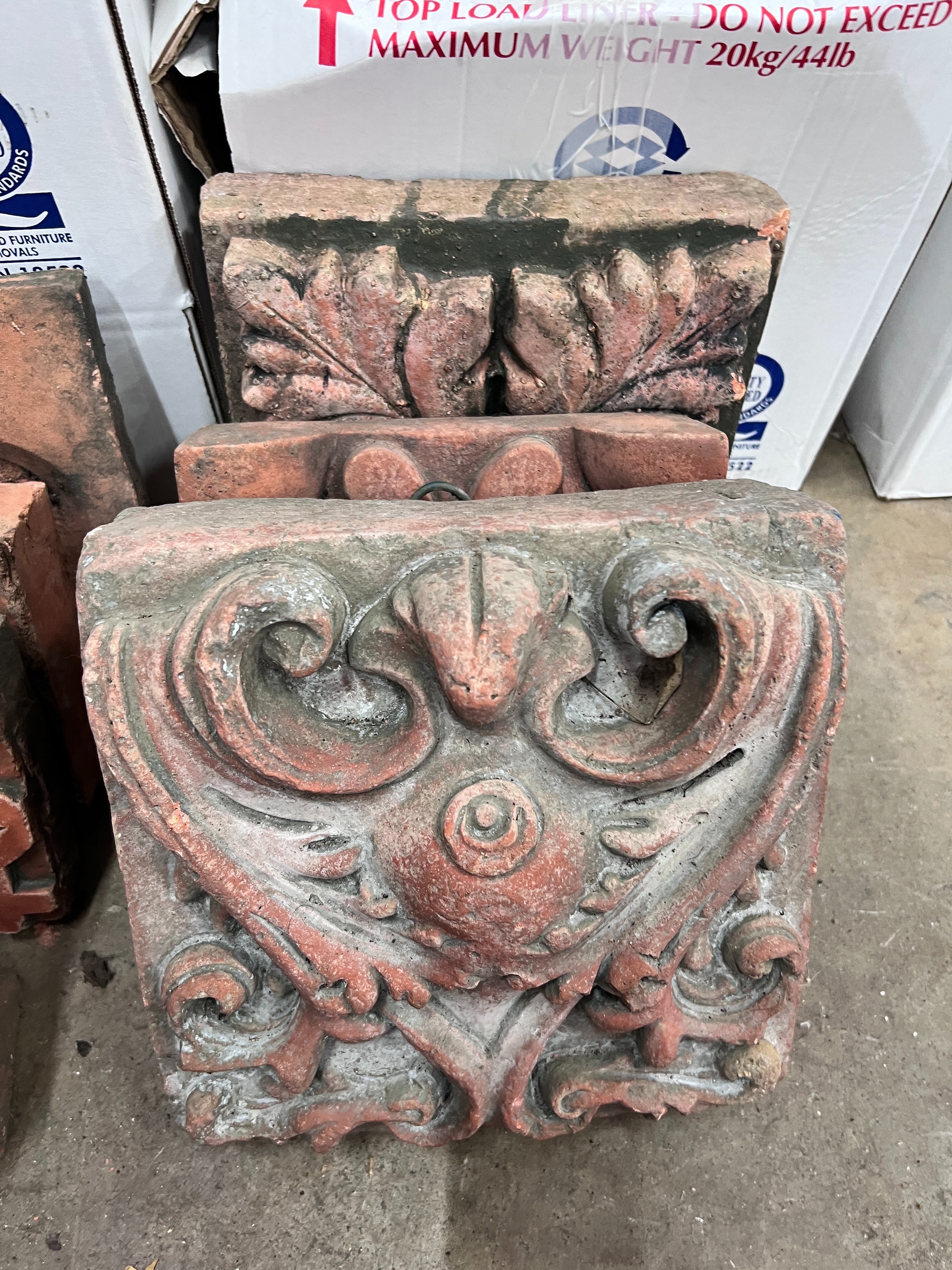 Seven assorted Victorian terracotta architectural decorative motifs, largest 25cm *Please note the sale commences at 9am.